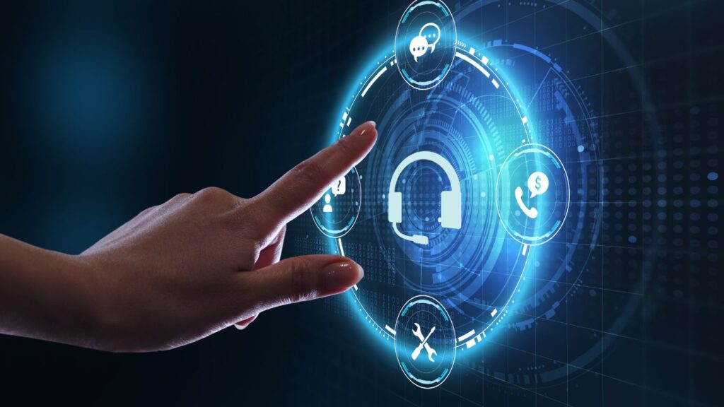 Eine Hand zeigt auf eine leuchtende digitale Schnittstelle mit einem zentralen Headset-Symbol, umgeben von Symbolen für Chat, Telefon, Einstellungen und Zahlung, die den technischen Support und die Innovationen des Customer Service Summit 2025 symbolisieren. - RUF Beratung - Ihre Contact Center Berater